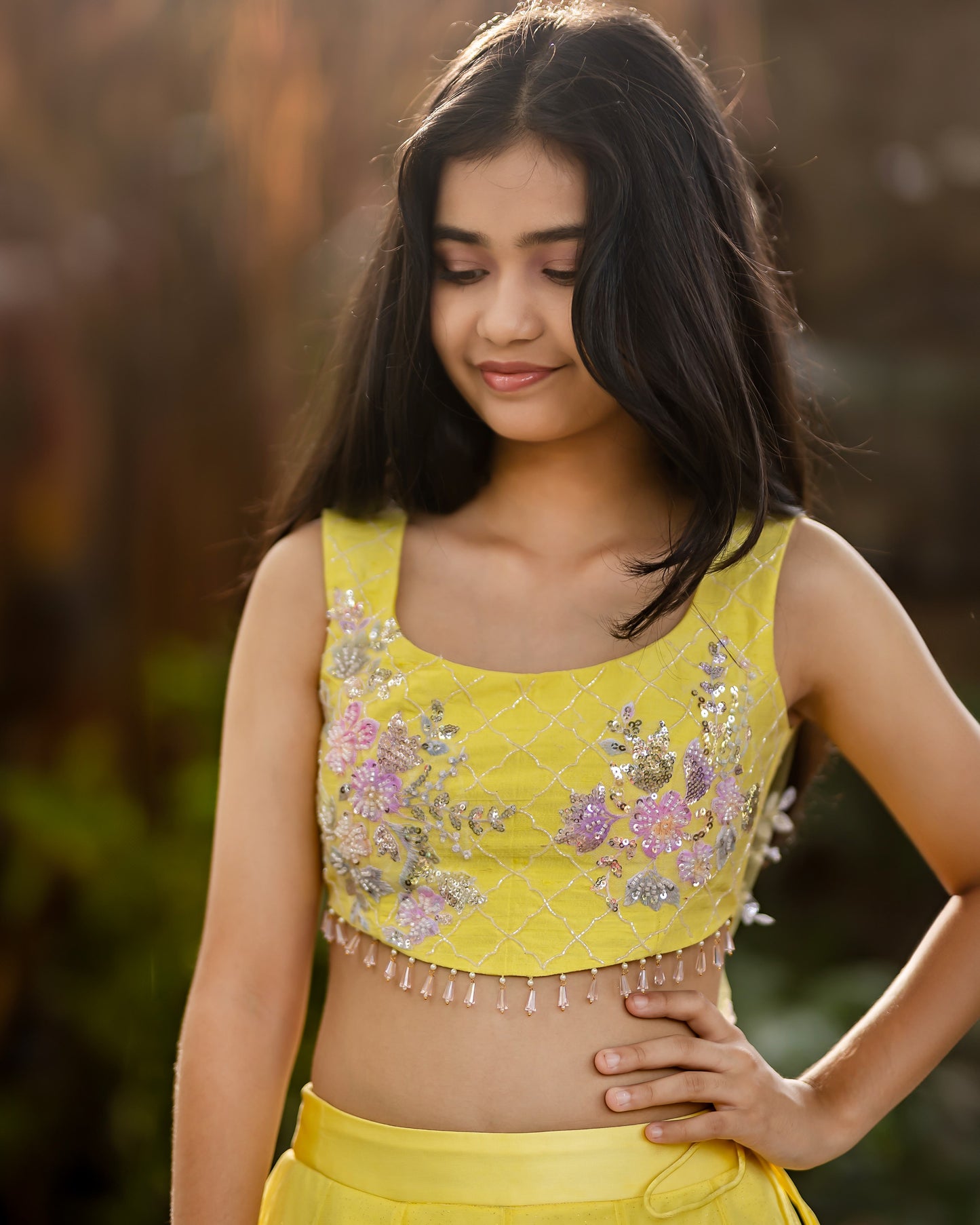 YELLOW NET LEHENGA WITH BUTTAS AND RAW SILK BLOUSE