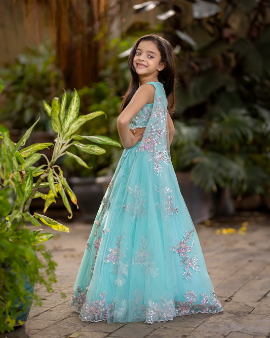 TEAL NET LEHENGA WITH EMBELLISHED RAW SILK BLOUSE