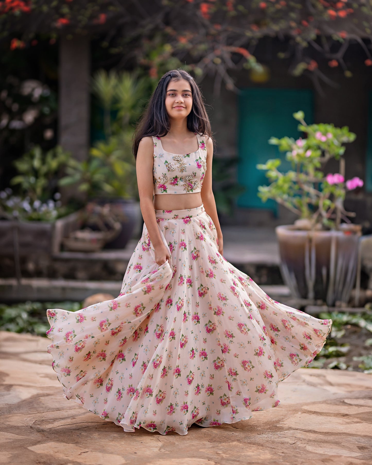 A FLORAL PEACH LEHENGA WITH CROP TOP.