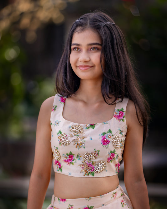 A FLORAL PEACH LEHENGA WITH CROP TOP.