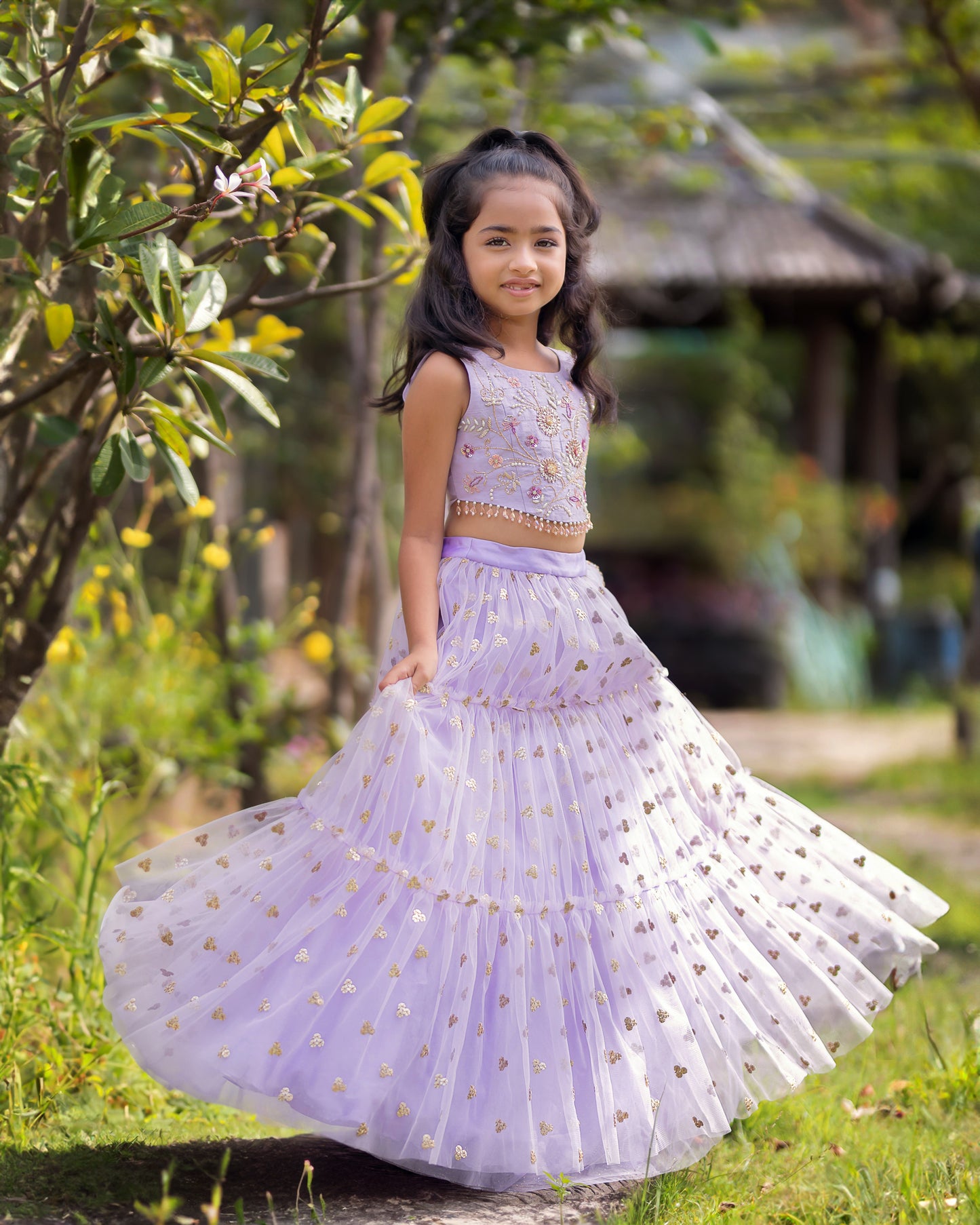 A LAVENDER TIER SEQUENCE LEHENGA WITH CROP TOP