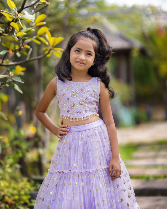 A LAVENDER TIER SEQUENCE LEHENGA WITH CROP TOP
