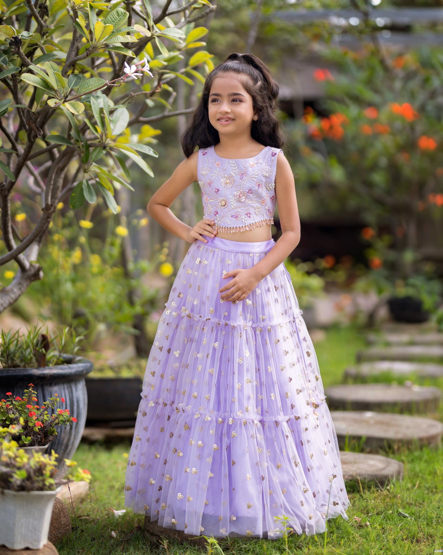 A LAVENDER TIER SEQUENCE LEHENGA WITH CROP TOP