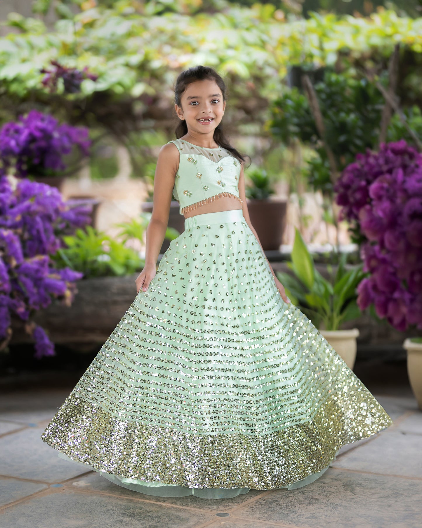 A LIGHT GREEN SEQUENCE LEHENGA WITH RAW SILK BLOUSE