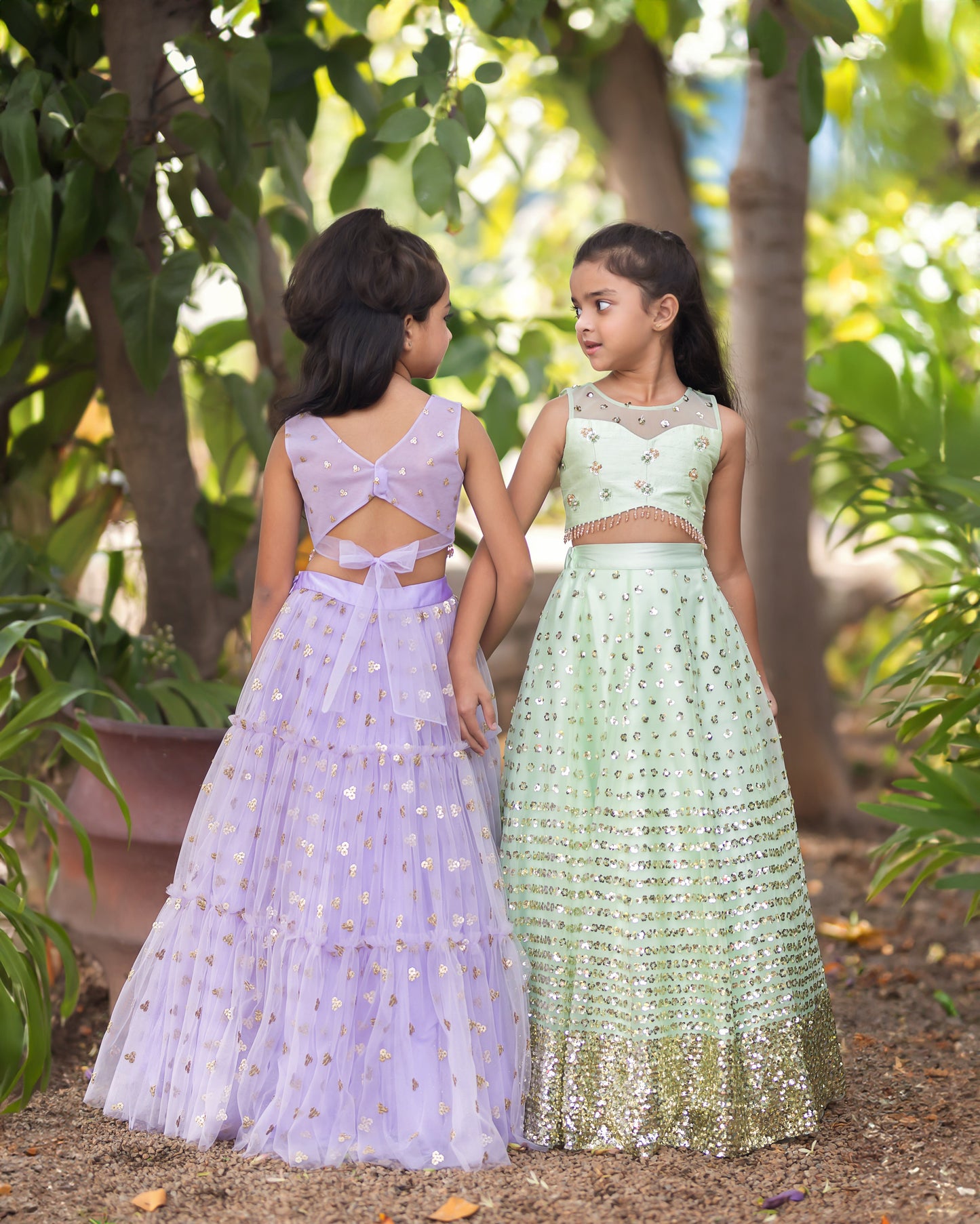 A LIGHT GREEN SEQUENCE LEHENGA WITH RAW SILK BLOUSE