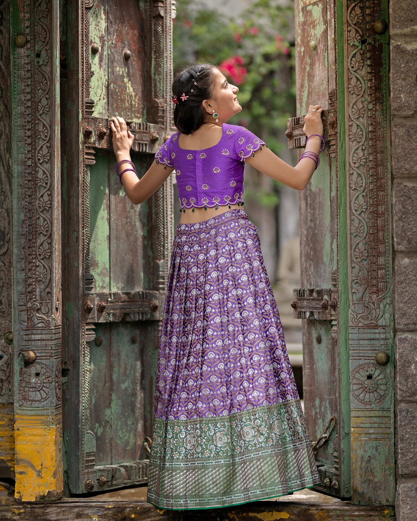 A DARK LAVENDER BANARASI LEHENGA WITH LAVENDER BLOUSE.