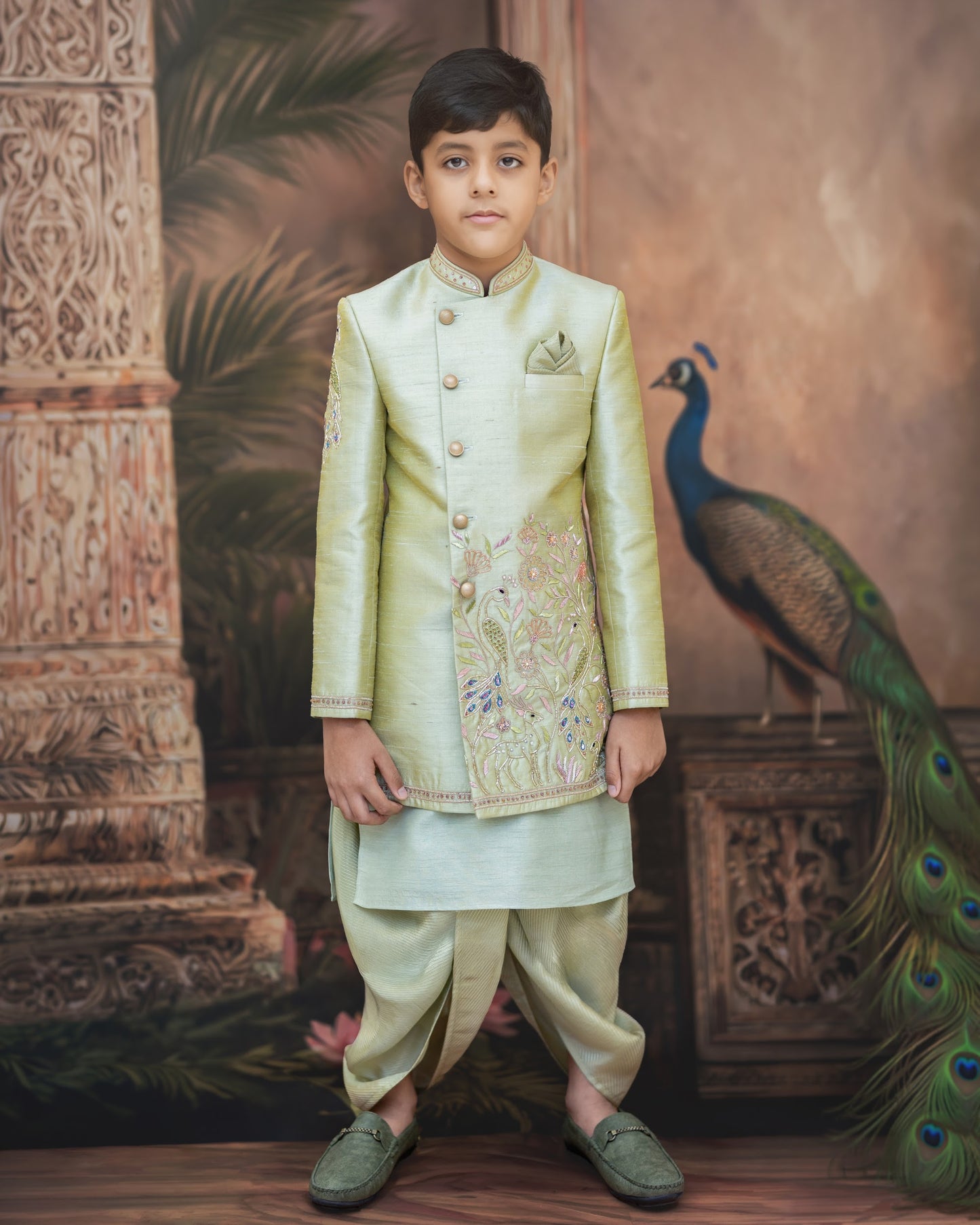 A SAGE GREEN SHERWANI WITH PEACOCK EMBROIDERY