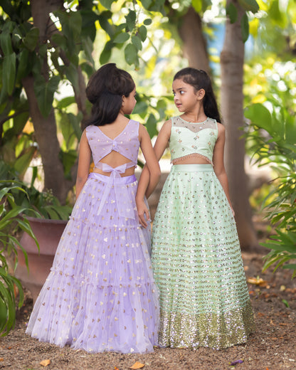 A LIGHT GREEN SEQUENCE LEHENGA WITH RAW SILK BLOUSE