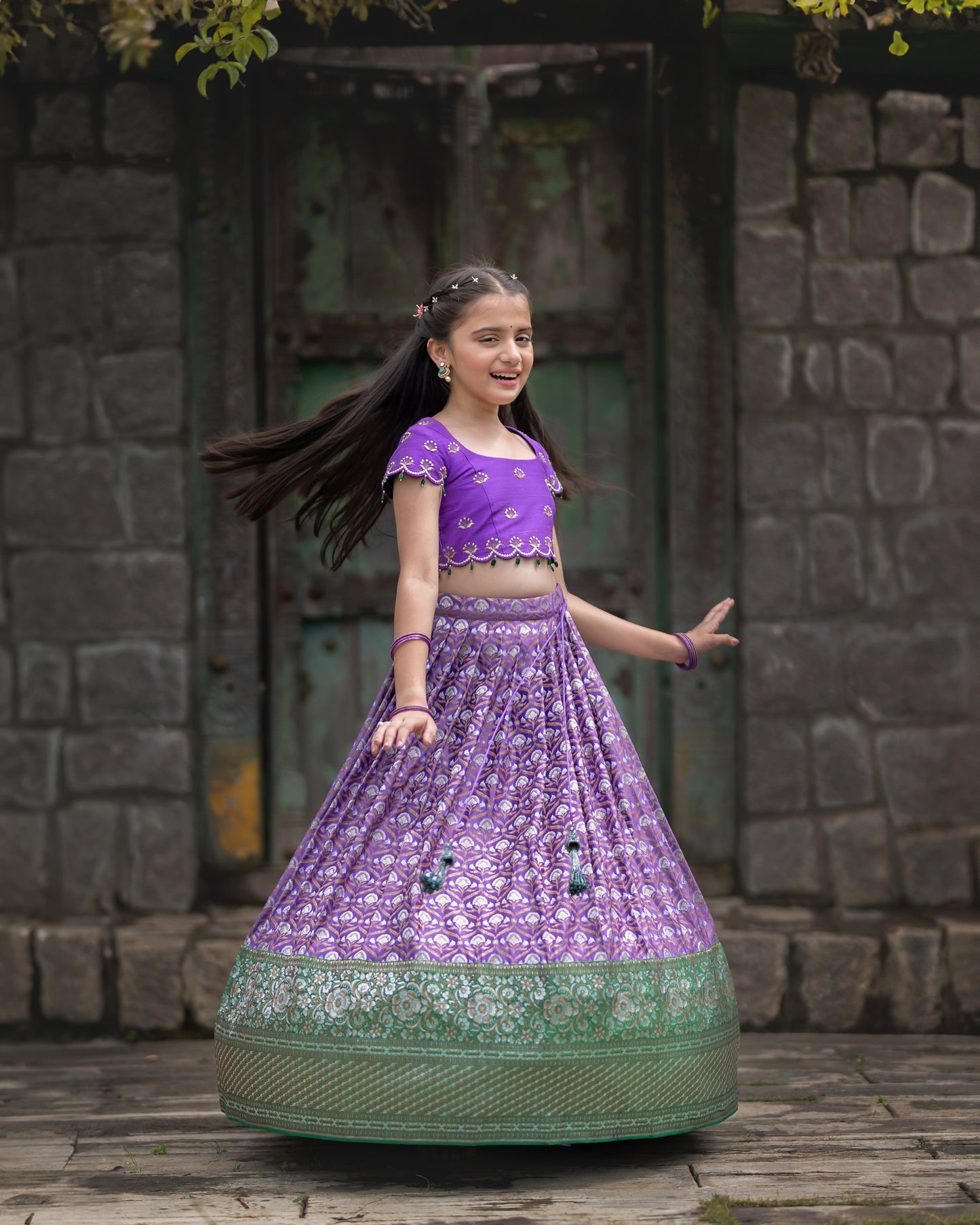 A DARK LAVENDER BANARASI LEHENGA WITH LAVENDER BLOUSE.