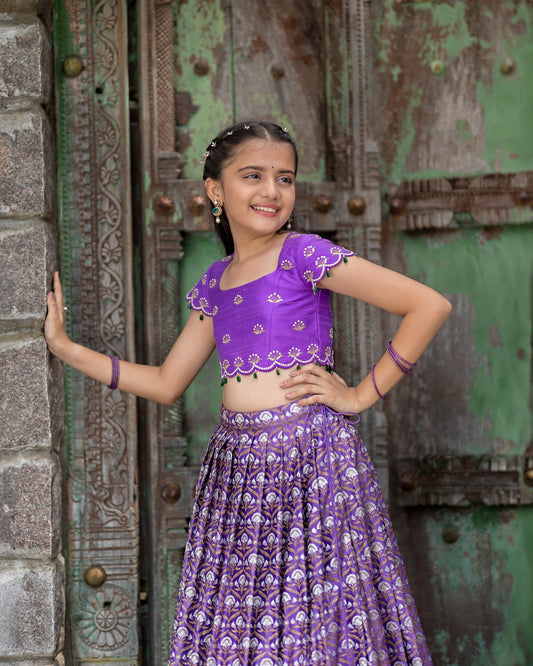 A DARK LAVENDER BANARASI LEHENGA WITH LAVENDER BLOUSE.